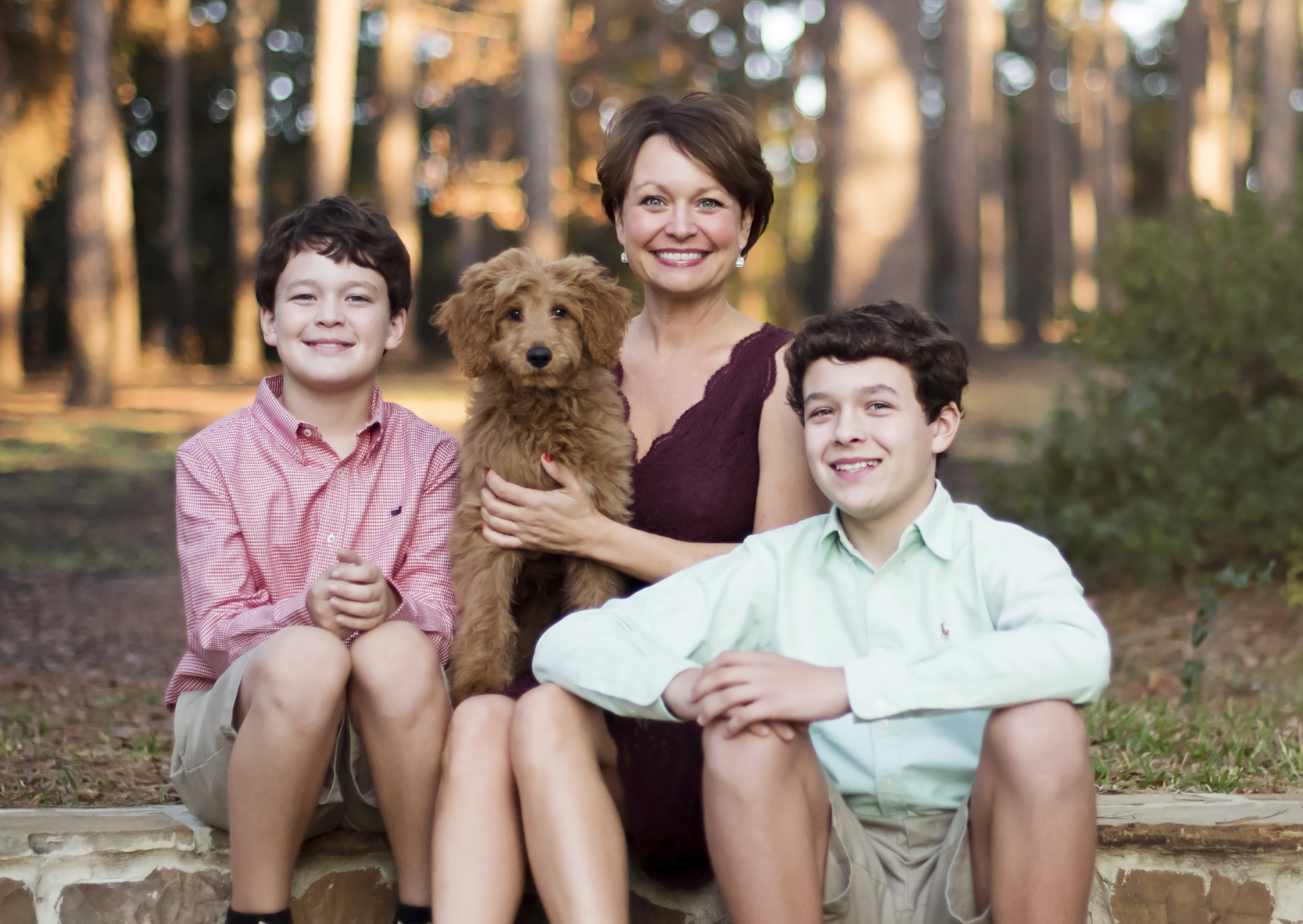 Misty Hudson with her sons and dog